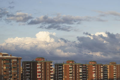 House buildings with big white clouds background