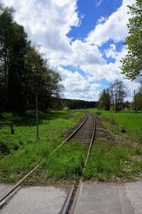 View of railway tracks against cloudy sky