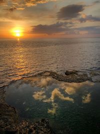 Scenic view of sea against sky during sunset