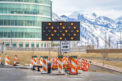 Text on road sign at construction site in city