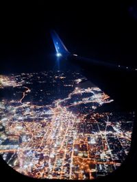 Aerial view of illuminated cityscape at night