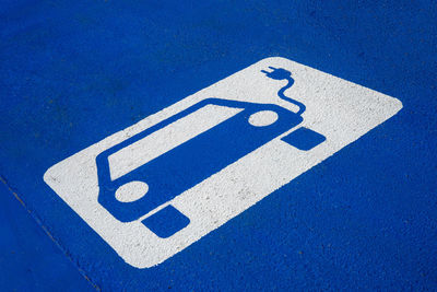 Close-up of electric vehicle charging station sign