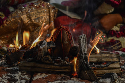 Coconut on fire in one of the ritual in indian marriage.