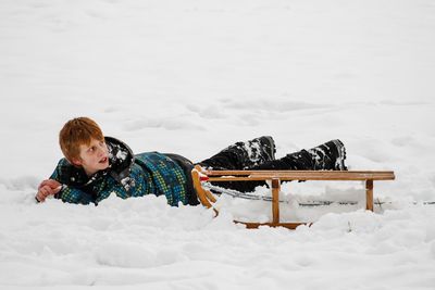 Boy playing in snow