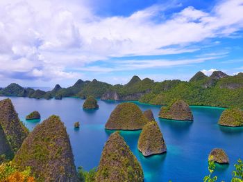 Panoramic view of lake and rocks against sky