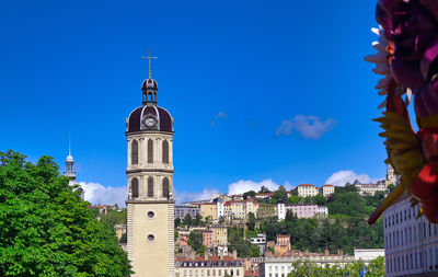 View of buildings against blue sky