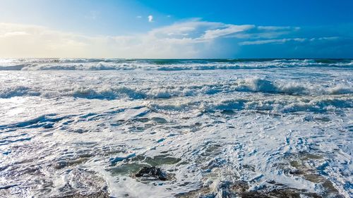 Close-up of sea against blue sky