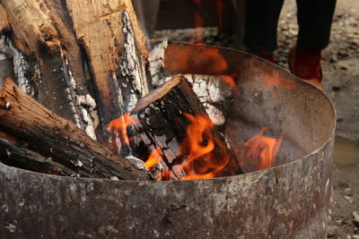 Wood burning in rusty fire pit