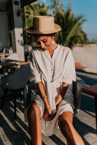 Young girl in a cafe overlooking the sea