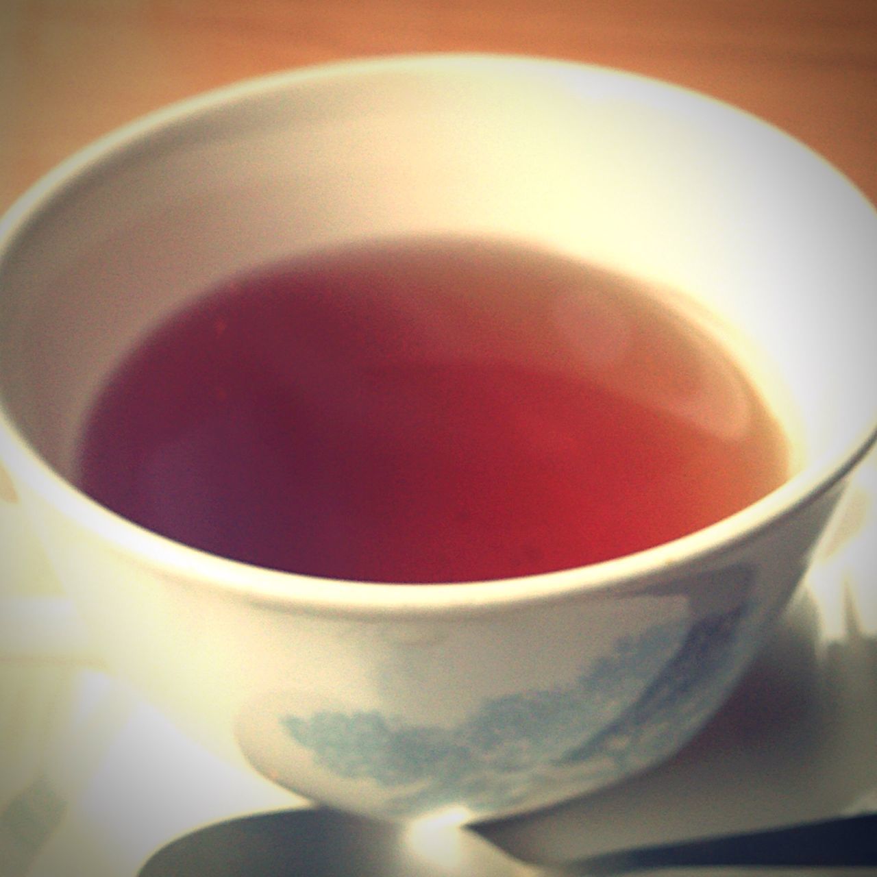 food and drink, drink, indoors, freshness, refreshment, coffee cup, red, close-up, still life, cup, coffee - drink, coffee, table, saucer, healthy eating, spoon, tea cup, high angle view, no people, frothy drink