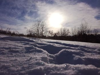 Scenic view of landscape against sky during winter