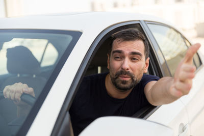 Close-up of man sitting in car