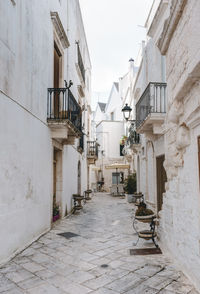 Empty alley amidst buildings in town