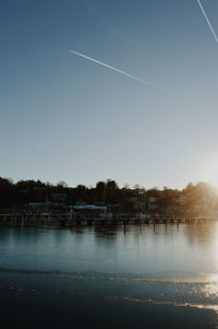 Scenic view of vapor trails against clear sky