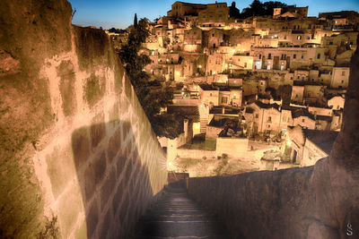 High angle view of steps leading towards illuminated houses in town