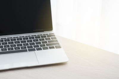 Close-up of laptop on table