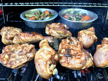 High angle view of meat on barbecue grill