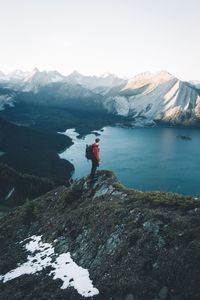 Scenic view of calm lake with mountains in background