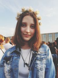 Portrait of beautiful woman against sky