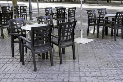 Empty chairs and tables in restaurant