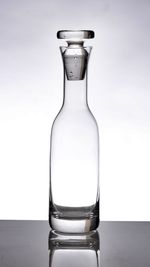 Bottle on table against white background