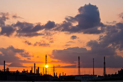 Low angle view of buildings against sky during sunset