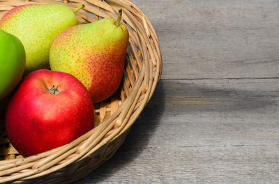 High angle view of apples in basket on table