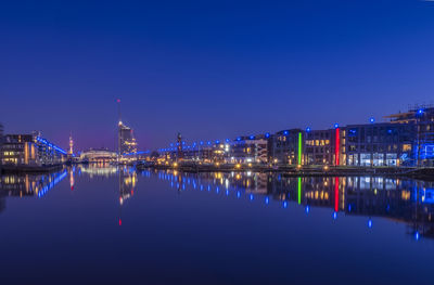 Reflection of illuminated buildings in water at night