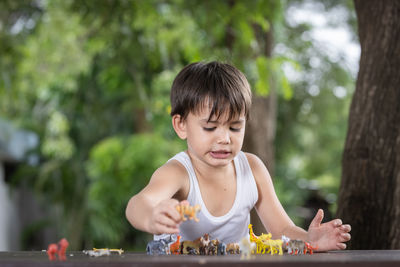 Boy playing on table