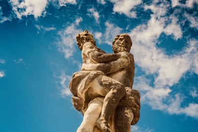 Low angle view of statue against sky