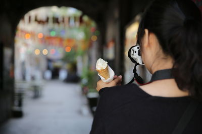 Close-up of woman photographing ice cream
