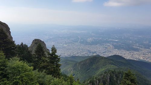 High angle view of trees and mountains against sky.