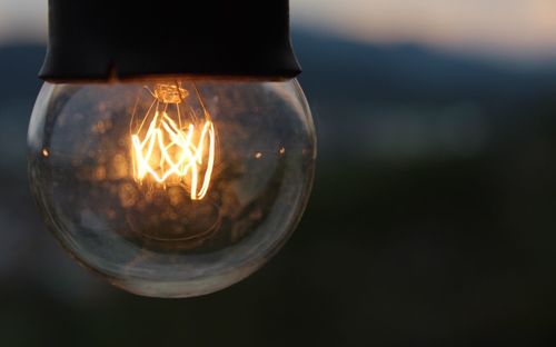 Close-up of illuminated light bulb