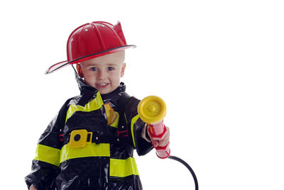 Portrait of cute boy against white background