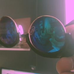 Close-up of hand holding sunglasses