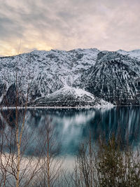 Scenic view of lake against sky during sunset