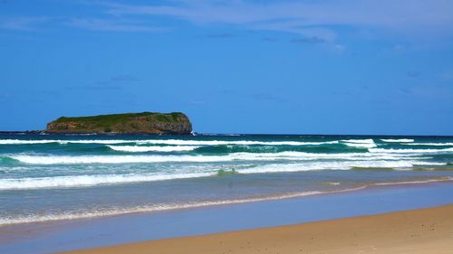 Scenic view of beach against sky