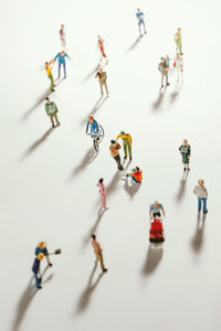 High angle view of figurines on white background