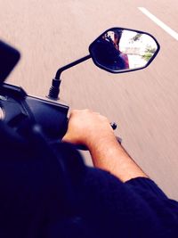 Close-up of man holding eyeglasses