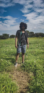 Full length of teenage girl standing on field