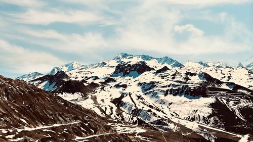 Scenic view of snowcapped mountains against sky