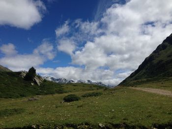 Scenic view of landscape and mountains against sky