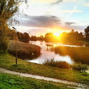 Scenic view of lake against sky during sunset