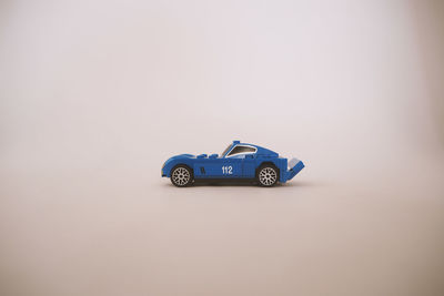 Close-up of toy car against white background