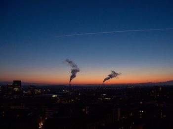 Cityscape against clear sky at night