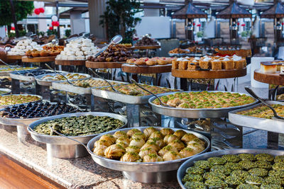 Traditional turkish desserts baklava and lokum in open buffet restaurant at hotel 