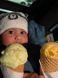 Portrait of boy holding ice cream