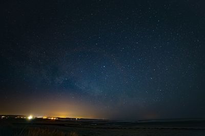 Scenic view of star field against sky at night