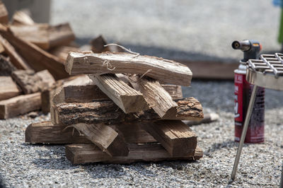 Stack of firewood on field