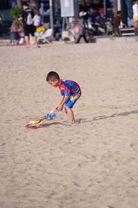 Boy playing on sand